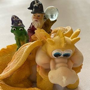 Adorable yellow dragon, wizard and toad on his back.